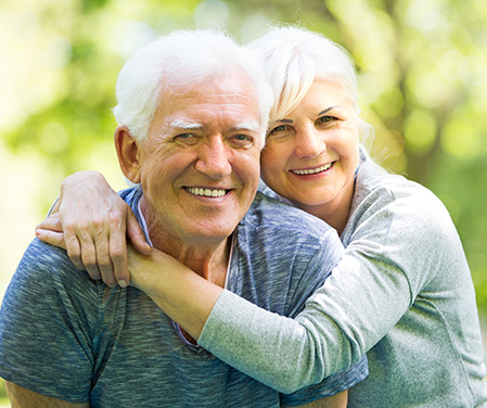 Elderly couple smiling after Cataracts