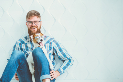 Young man with eyeglasses considering LASIK