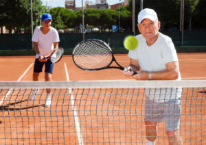 two people playing tennis