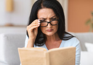 woman using reading glasses 