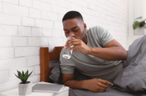 man having a drink of water