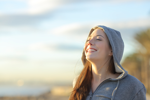 Young woman smiling after LASIK