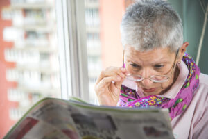 woman reading newspaper