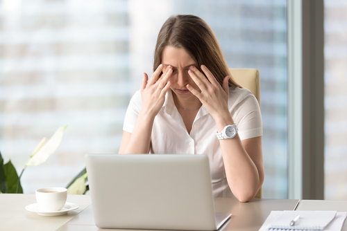 Young woman suffering from Dry Eyes